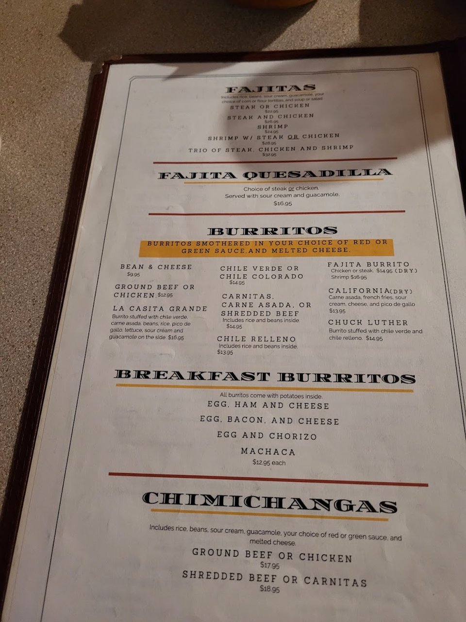 Restaurant menu highlighting comfort food and small plates.